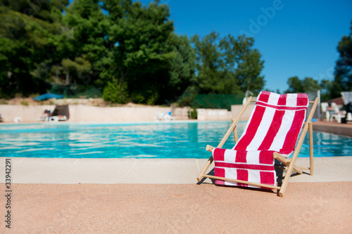 Beach chair near swimming pool