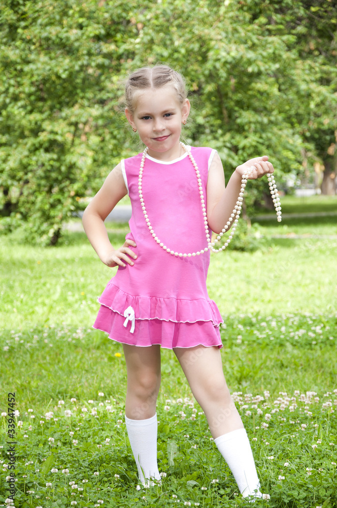 portrait of a young blond girl in pink dress portrait of a young blond girl in pink dress