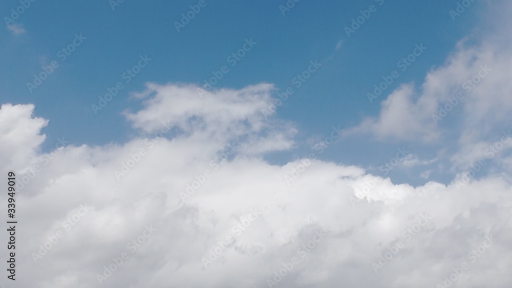 Time lapse clip of white fluffy clouds over blue sky Time lapse clip of white fluffy clouds over blue sky