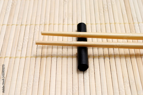 japanese chopsticks on bamboo placemat background photo