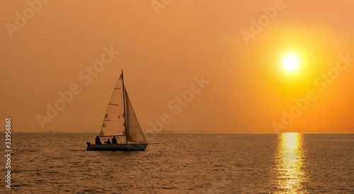Sailing boat at sunset © aragami