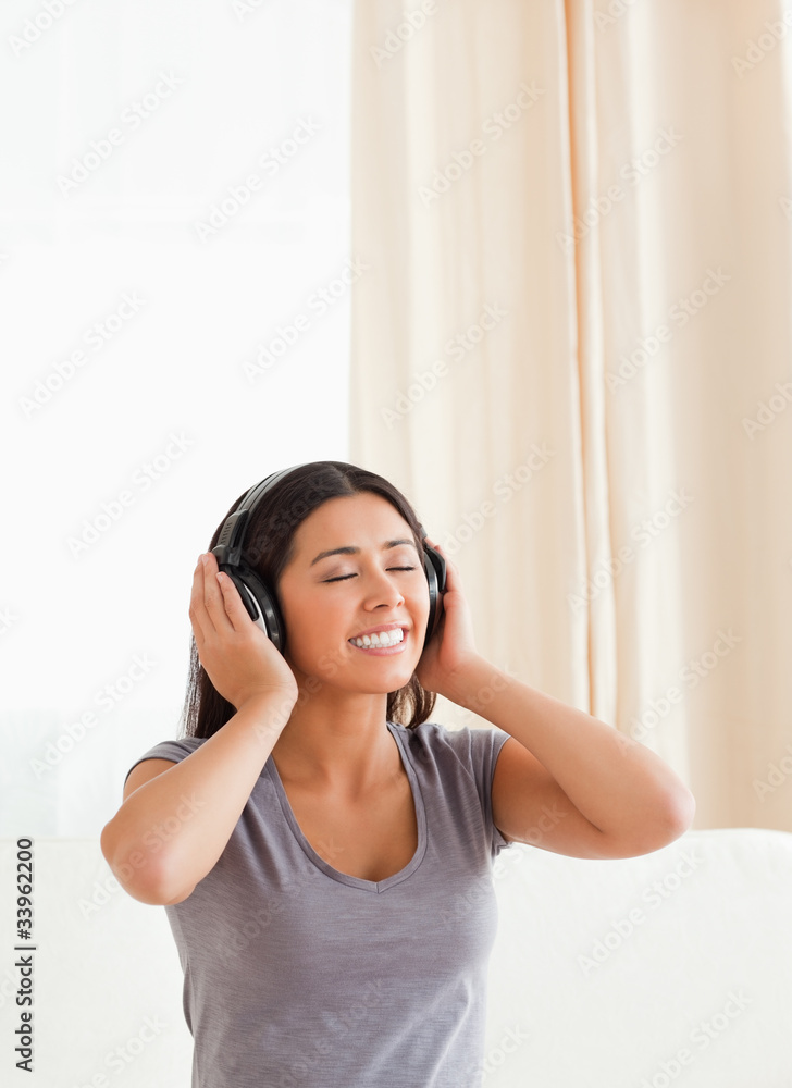 charming woman with closed eyes and earphones charming woman with closed eyes and earphones