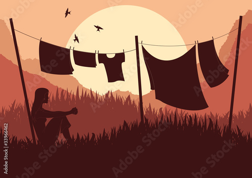 Women drying clothes in wild African nature