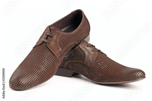 Pair of brown male shoes over white