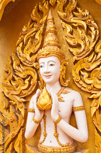 Angel decoration of buddhist temple tilted out