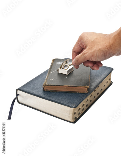 reading bible with magnifying glass