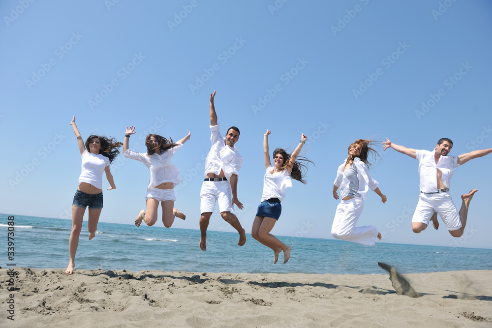 happy people group have fun and running on beach happy people group have fun and running on beach