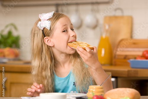 girl eating breakfast photo