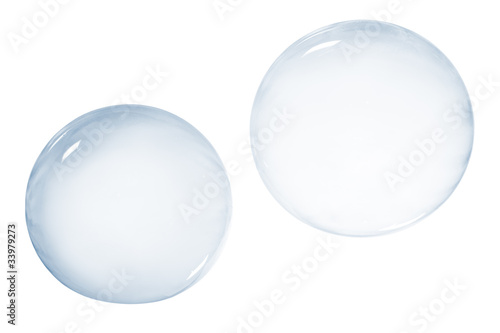 Two soap bubbles isolated on white background