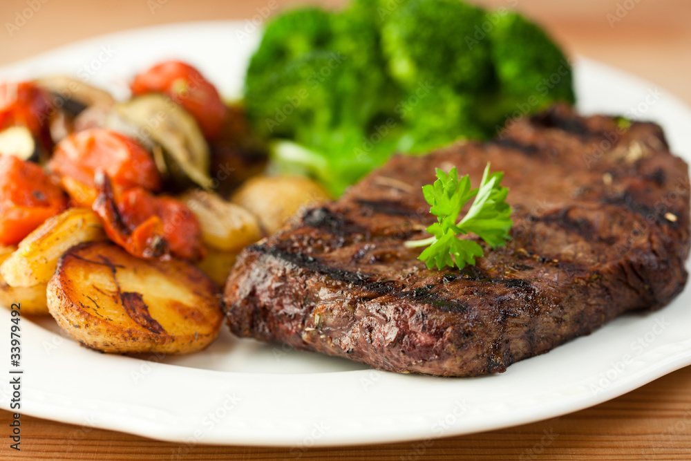 Grilled steak and vegetables on a plate