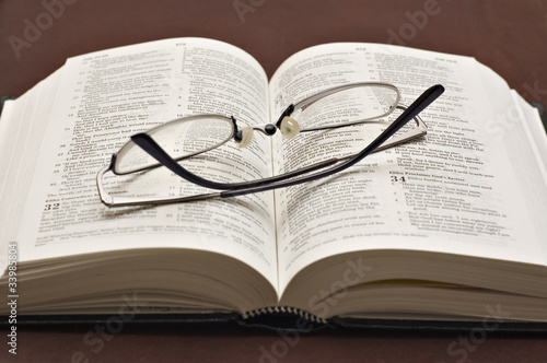 Holy bible with spectacles