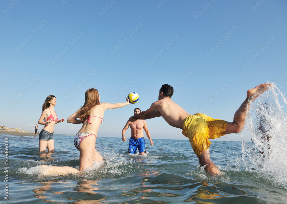 young people group have fun and play beach volleyball young people group have fun and play beach volleyball