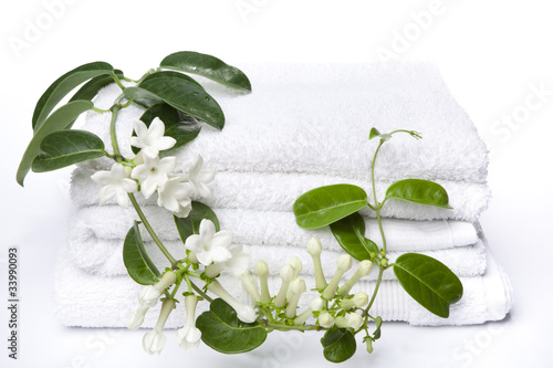 White towels with white flowers for wellness