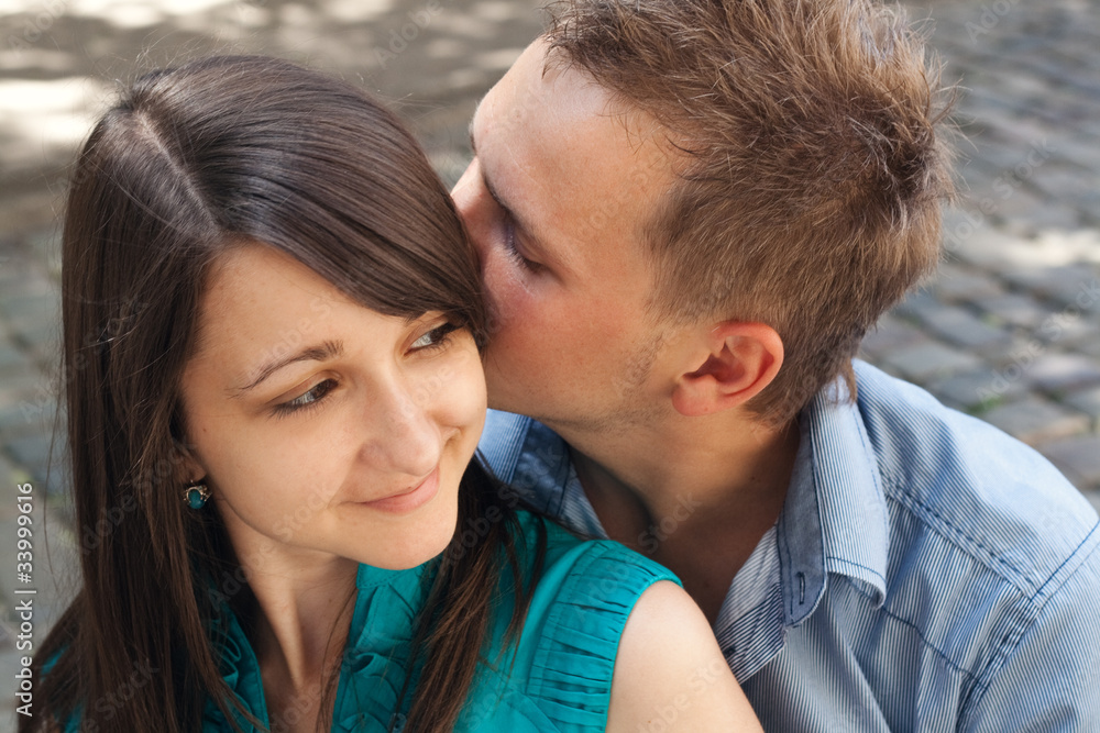 Love young couple kissing in the street Love young couple kissing in the street