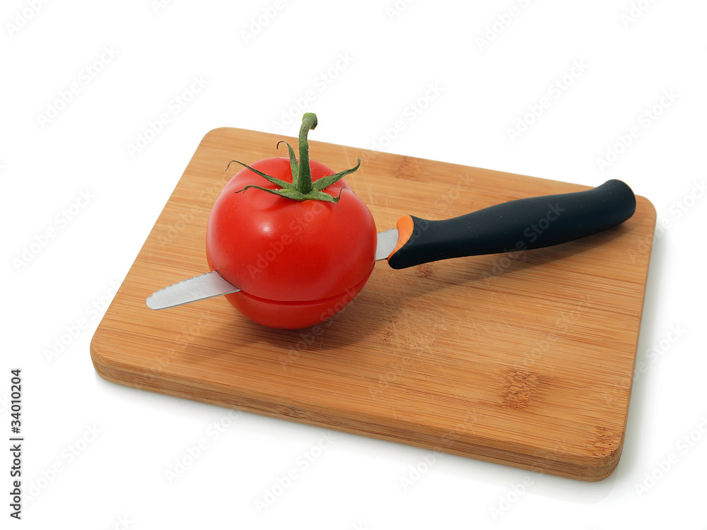 Red tomato on the white background Red tomato on the white background
