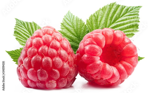 Two perfect raspberries with leaves.