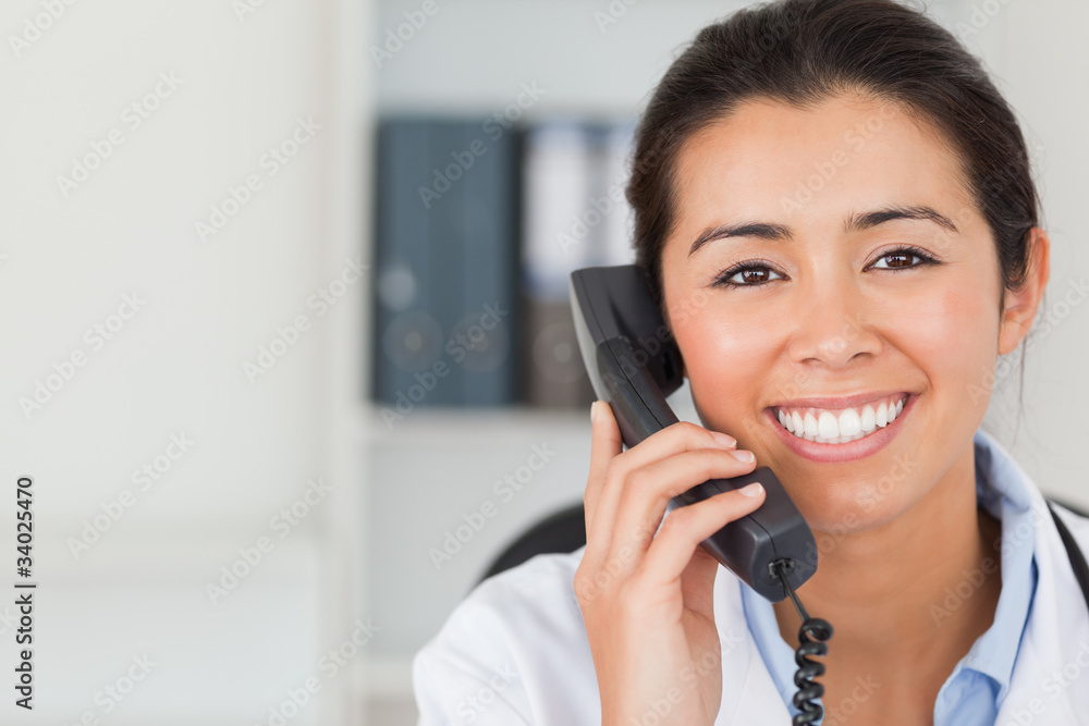 Gorgeous female doctor on the phone and posing Gorgeous female doctor on the phone and posing
