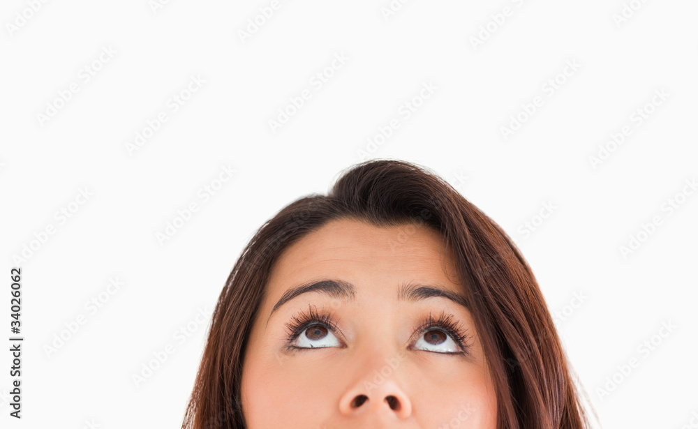 Portrait of a beautiful woman looking up while standing Portrait of a beautiful woman looking up while standing