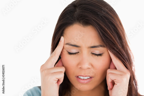 Wallpaper Mural Portrait of a good looking woman having a headache while standin Torontodigital.ca