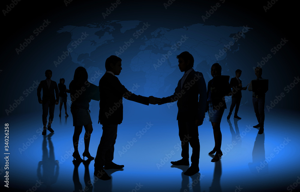 Silhouettes of business partners ,Shake