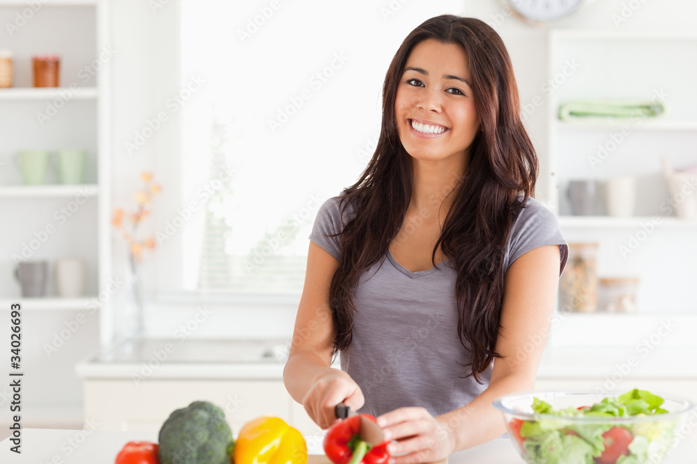 Attractive woman cooking vegetables while standing Attractive woman cooking vegetables while standing