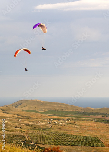 paragliding in mountain near the sea