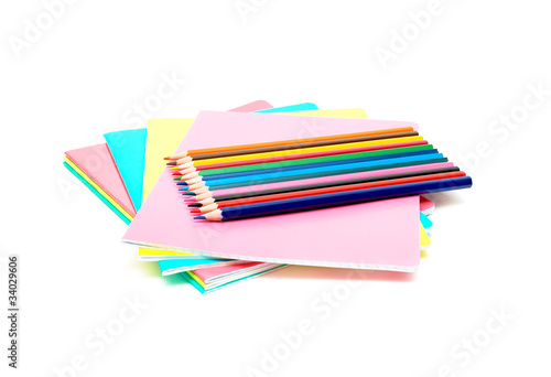 notebooks and pencils colored