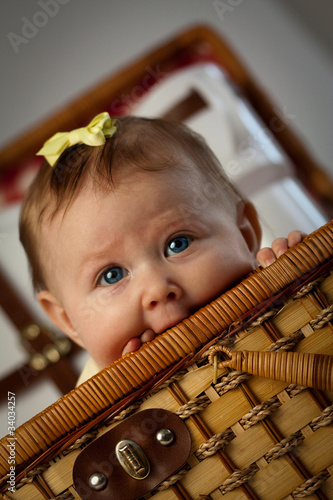 Child Peeking out of Picnic Basket