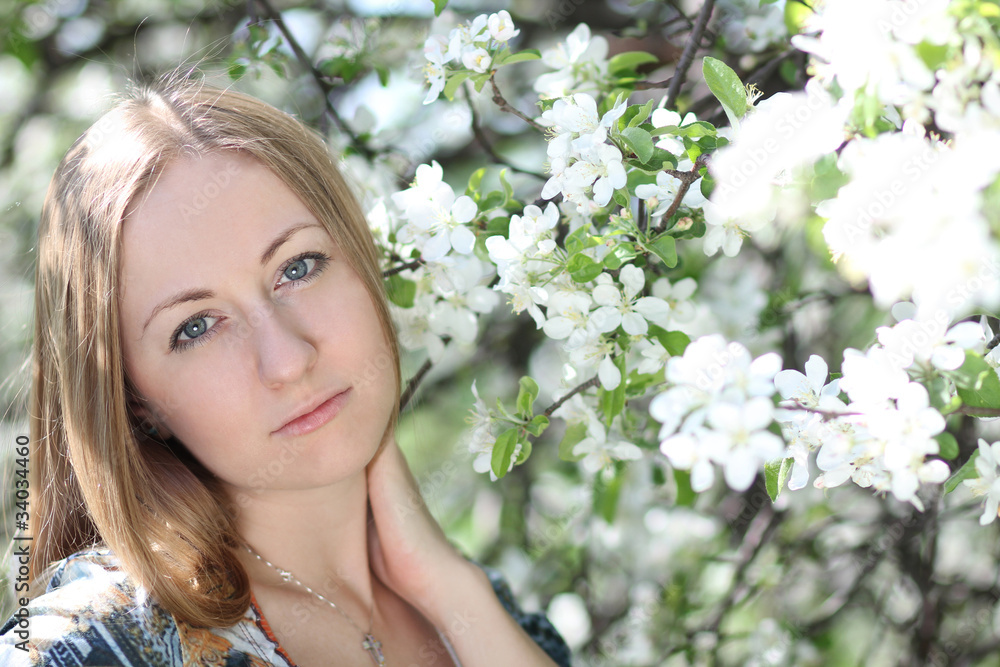 Portrait of beautiful blond in spring blossom Portrait of beautiful blond in spring blossom