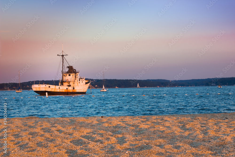 Sunset on beach and fishing boat Sunset on beach and fishing boat