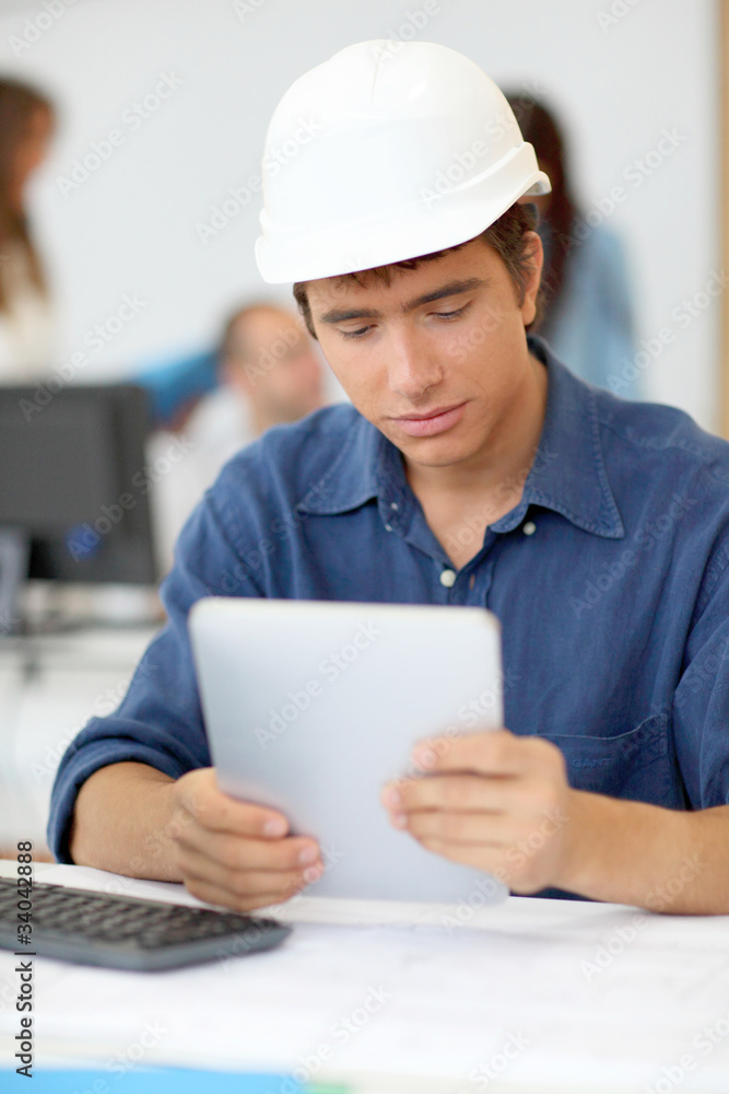 Student in architecture using electronic tablet Student in architecture using electronic tablet
