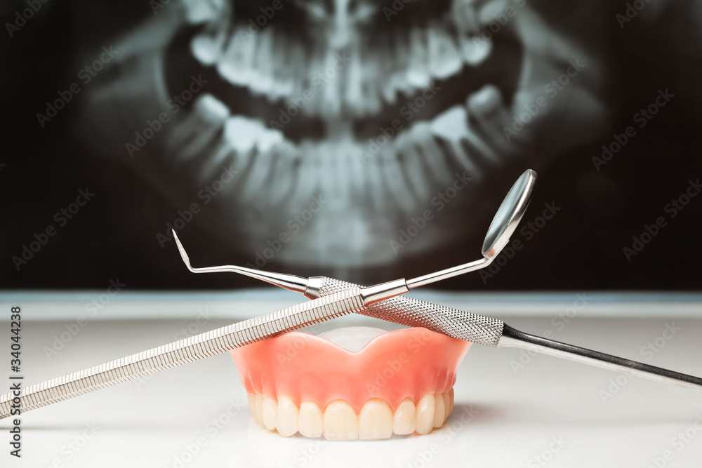 Pan x-ray, denture and dental instruments.