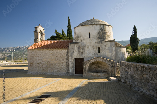 Seline old church with a turret © lexlero