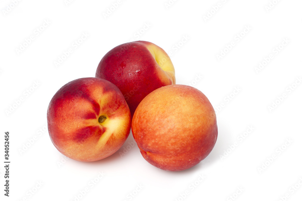 Juicy peaches isolated on white background