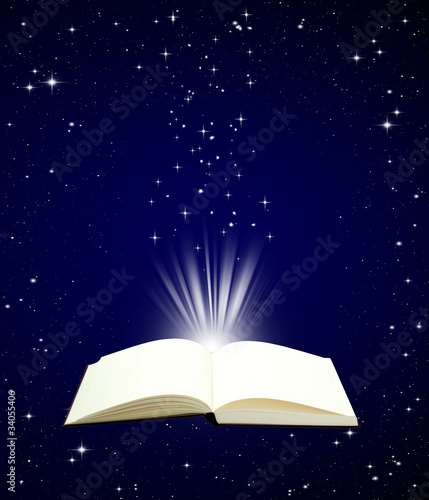 Open book magic on night sky background - Education concept