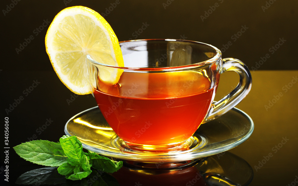 tea with lemon and mint on yellow background tea with lemon and mint on yellow background