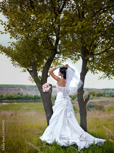 Bride in nature in a wedding dress © Maxim Vlasenko