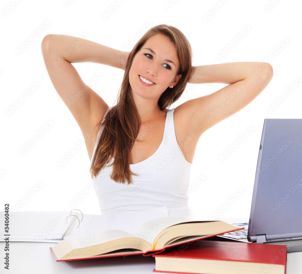 Motivierte Studentin sitzt am Schreibtisch Motivierte Studentin sitzt am Schreibtisch