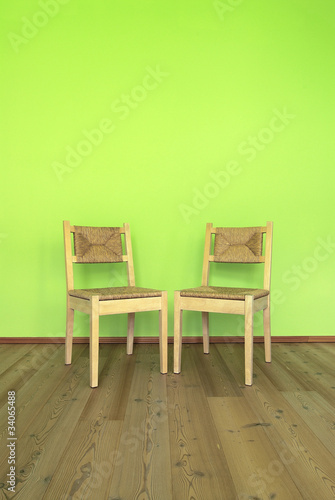 Two wooden chairs in a room