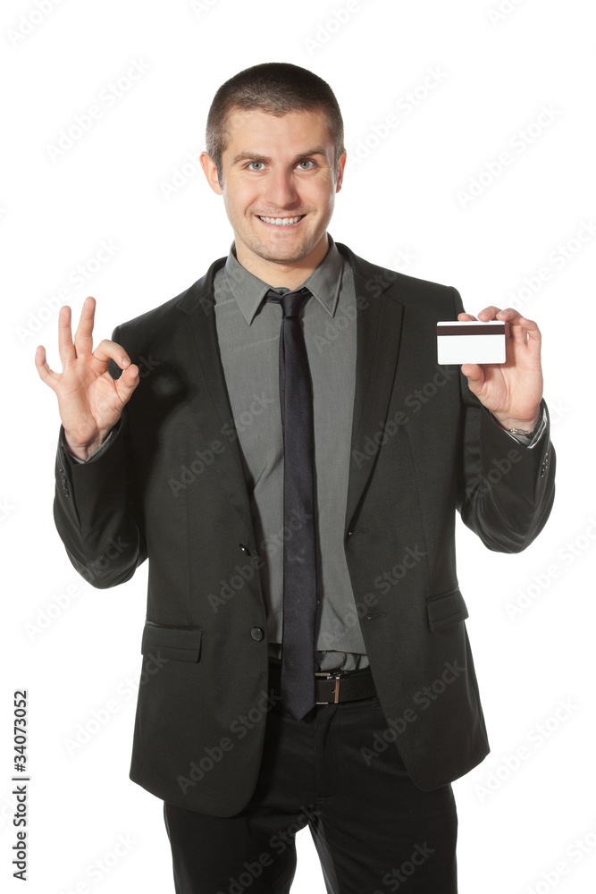 Happy businessman with credit card showing OK sign