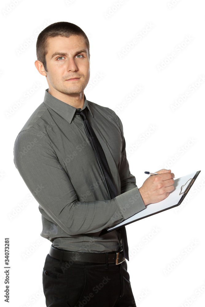 Business man making notes on a clipboard. Business man making notes on a clipboard.