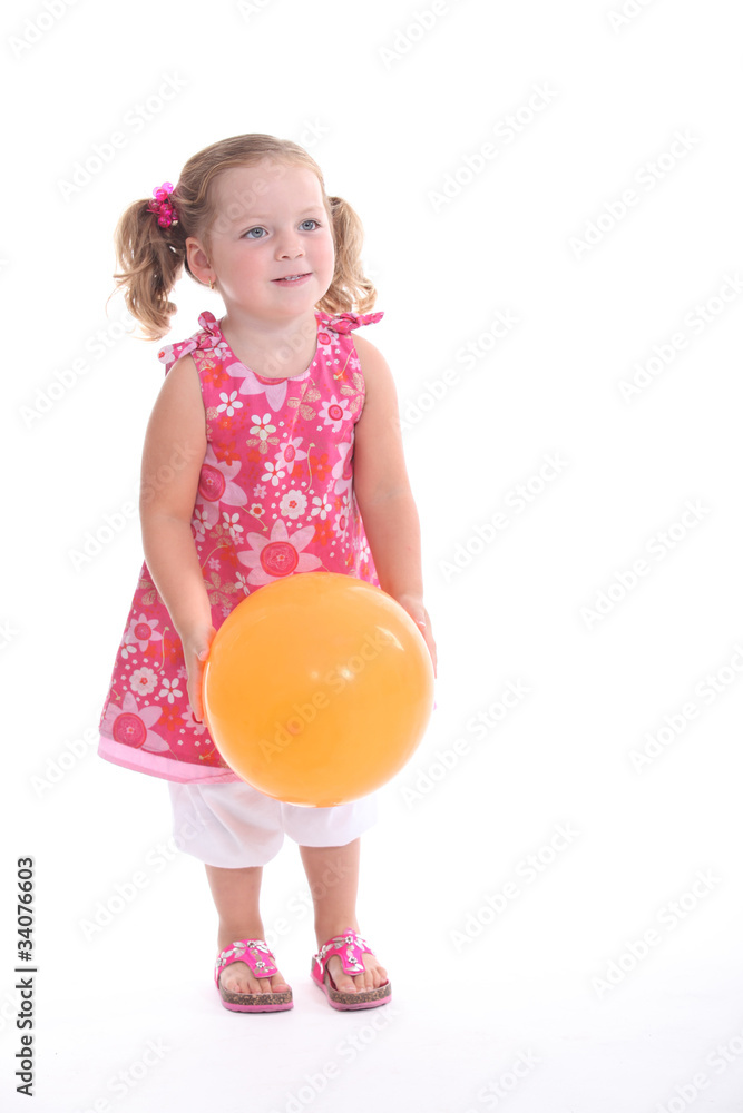 Studio shot of a little girl with a balloon Studio shot of a little girl with a balloon