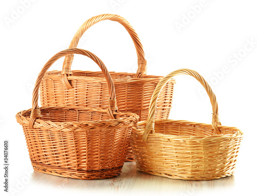 Empty wicker baskets isolated on white