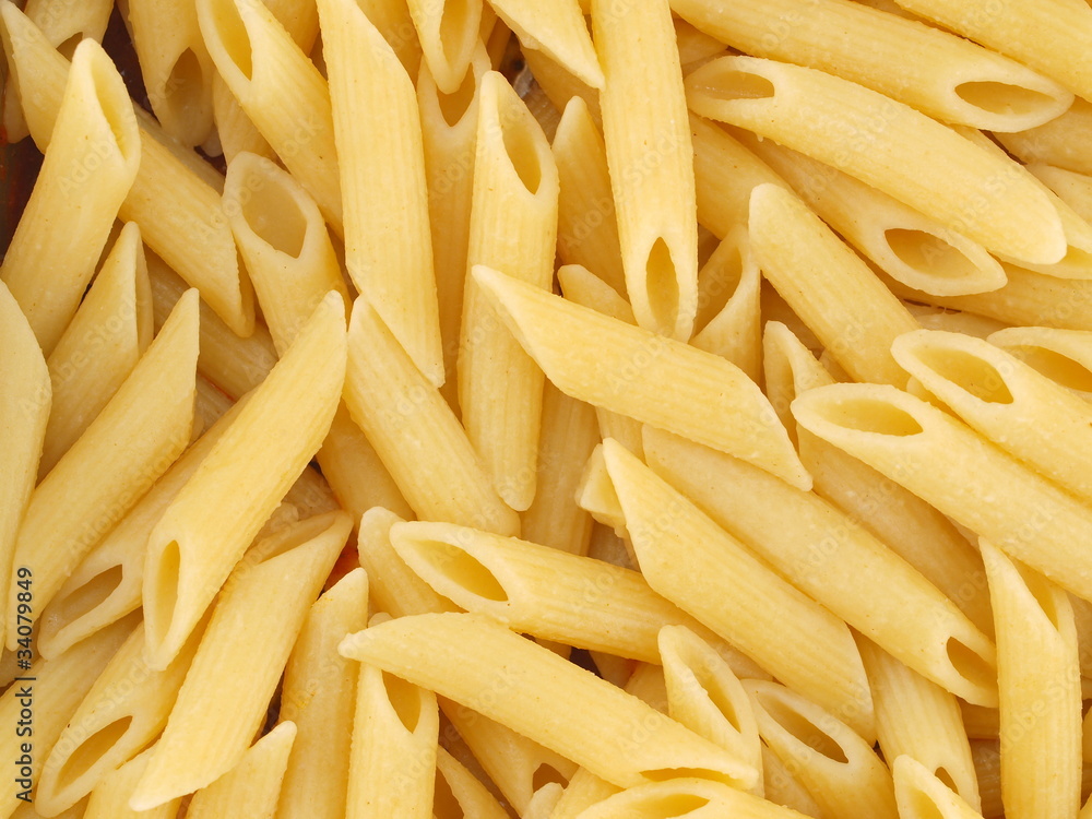 Closeup Background of Cooked Italian Penne Pasta Closeup Background of Cooked Italian Penne Pasta