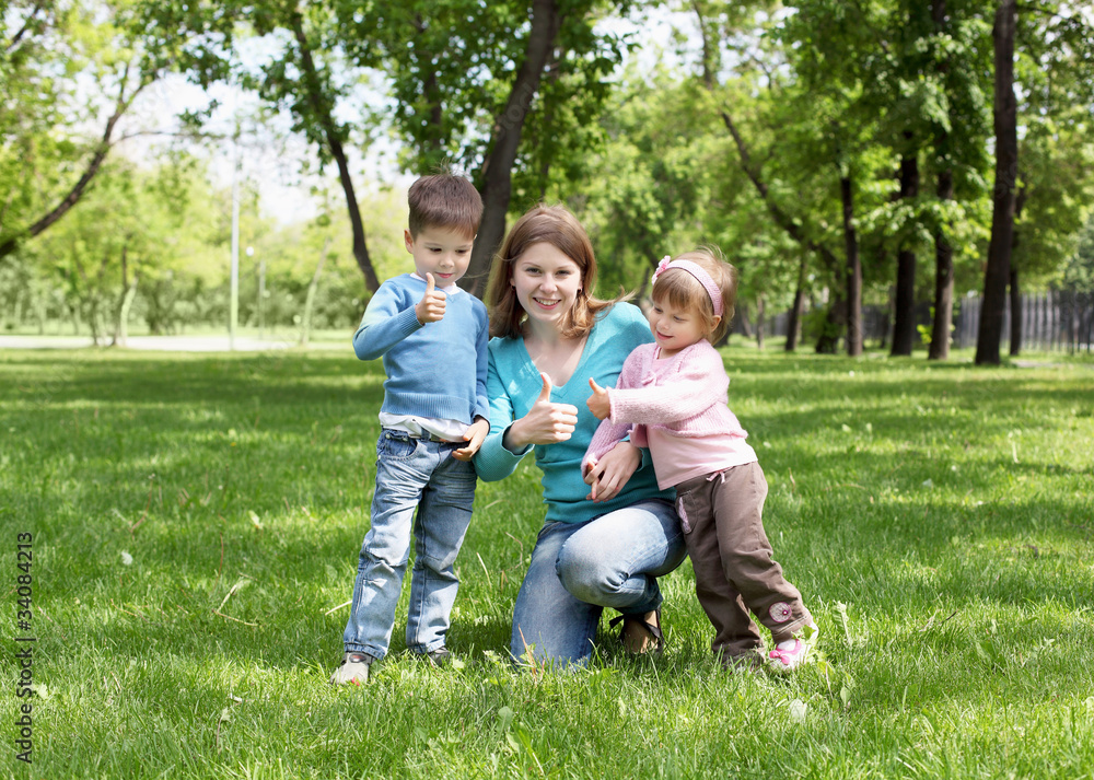 Portrait of mother and children in the park Portrait of mother and children in the park