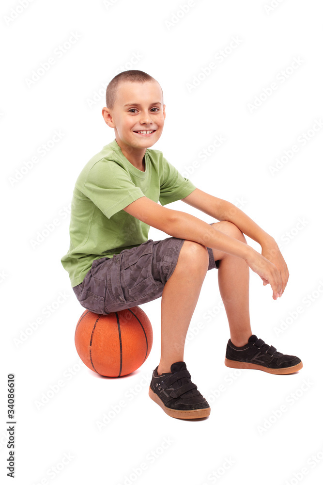 Child with basketball isolated on white background
