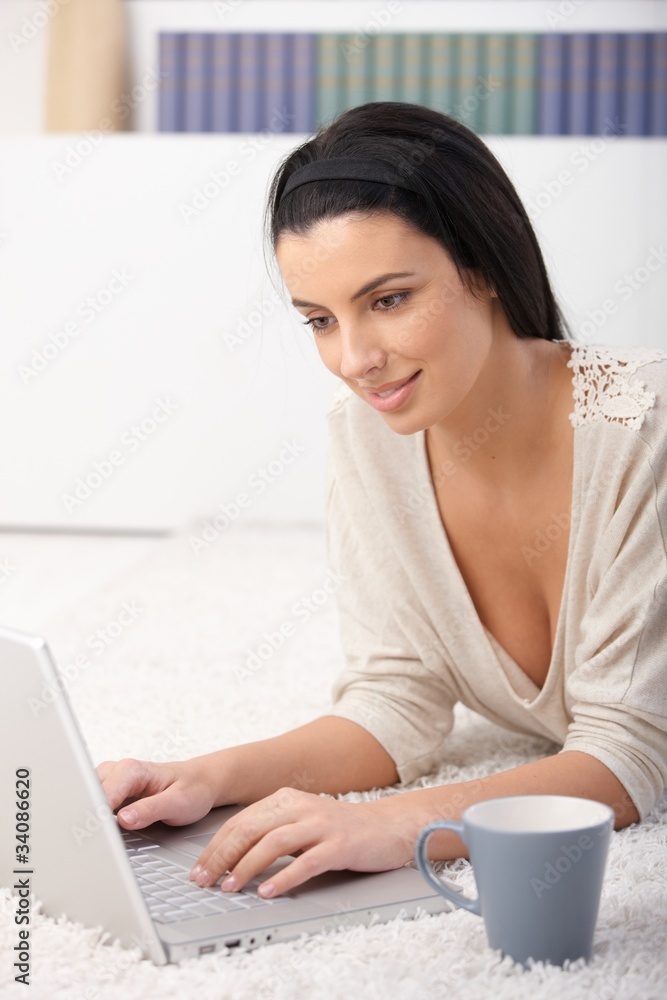 Woman using computer at home Woman using computer at home