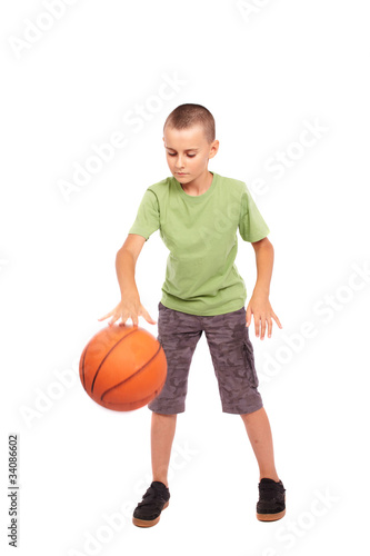 Child with basketball isolated on white background © Xalanx