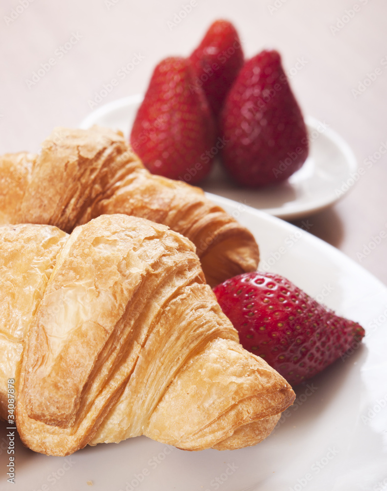 croissants close up with strawberry croissants close up with strawberry