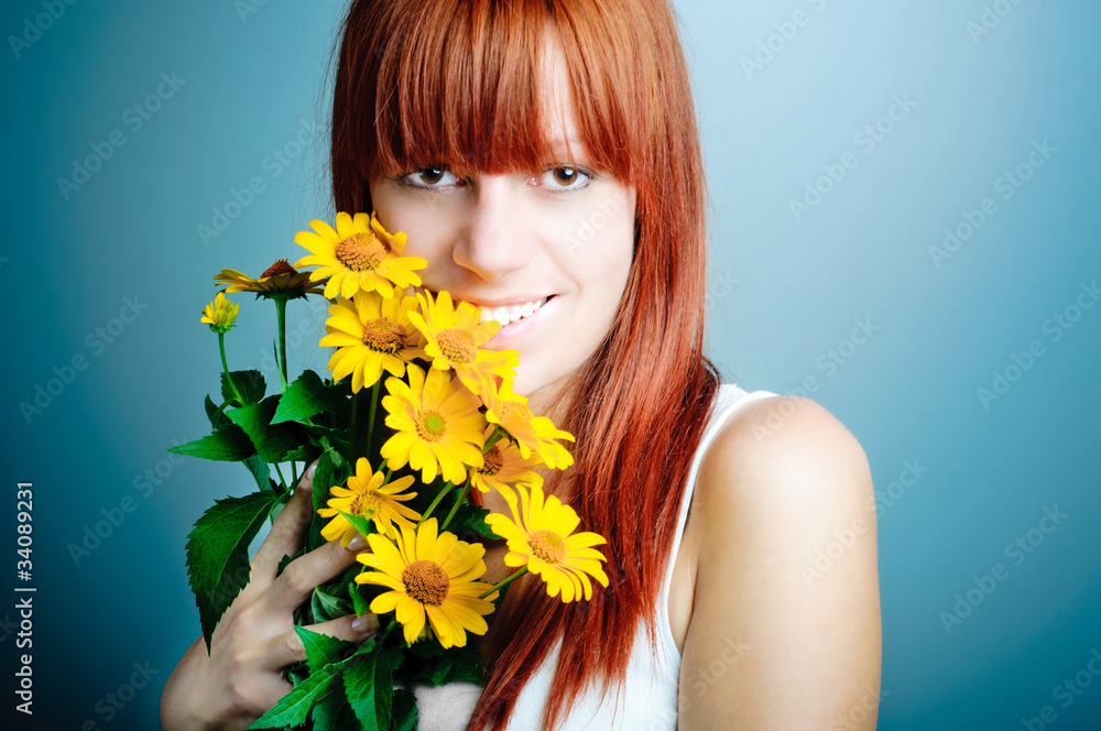 Closeup portrait of cute young girl with yellow flowers smiling Closeup portrait of cute young girl with yellow flowers smiling